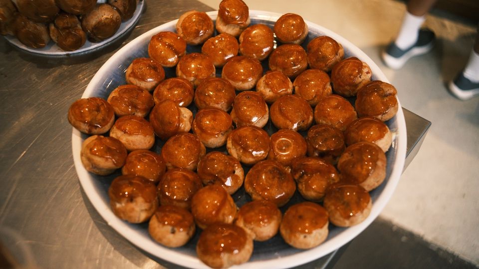 A platter of glossy caramel-topped pastries